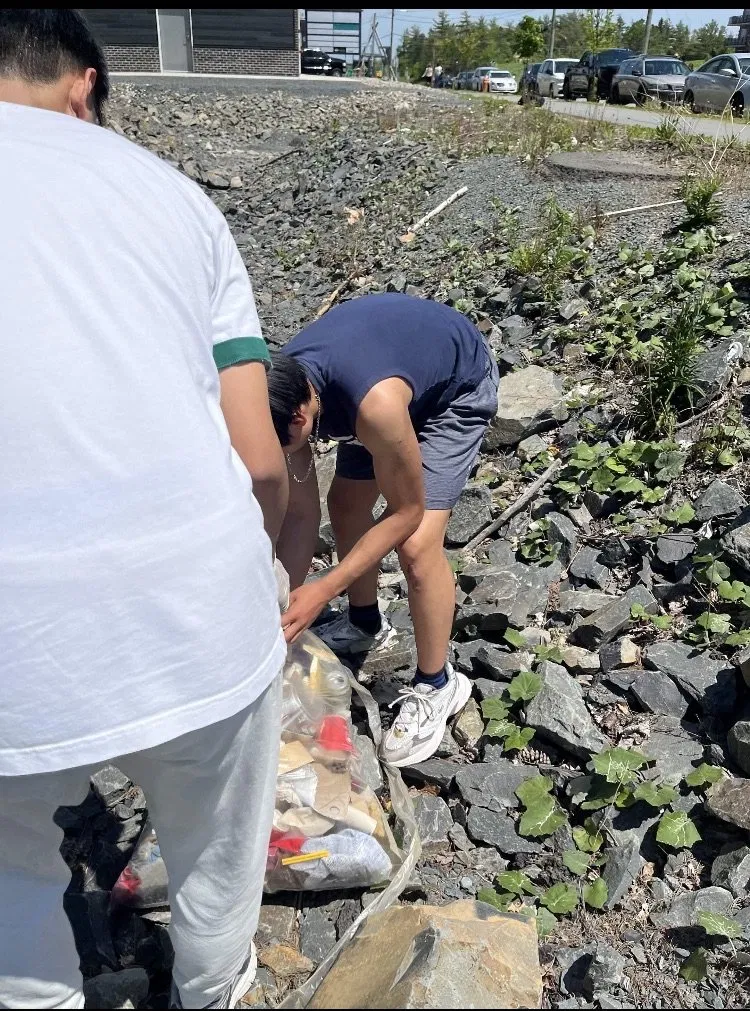 Student actively collecting litter during the cleanup